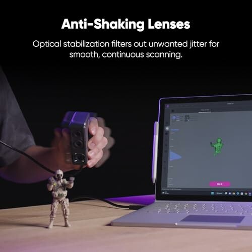 Demonstration of anti-shaking lenses with a scanner and laptop.