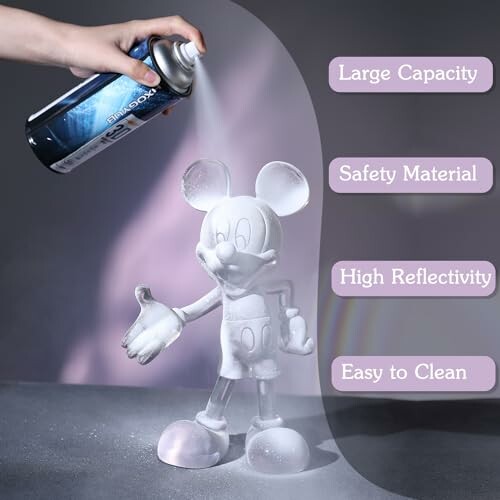Hand spray painting a mouse statue with labeled features: large capacity, safety material, high reflectivity, easy to clean.